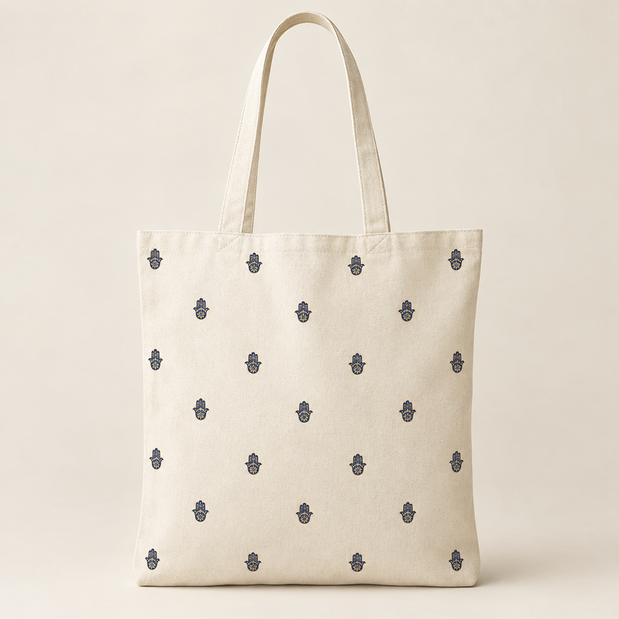 Ivory tote with tiny Hamsas dotted across the front