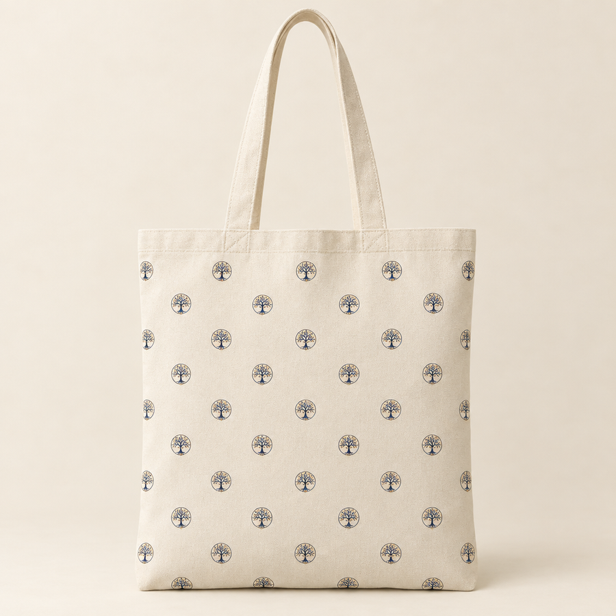 Ivory tote with tiny Tree of Life emblems dotted across the front
